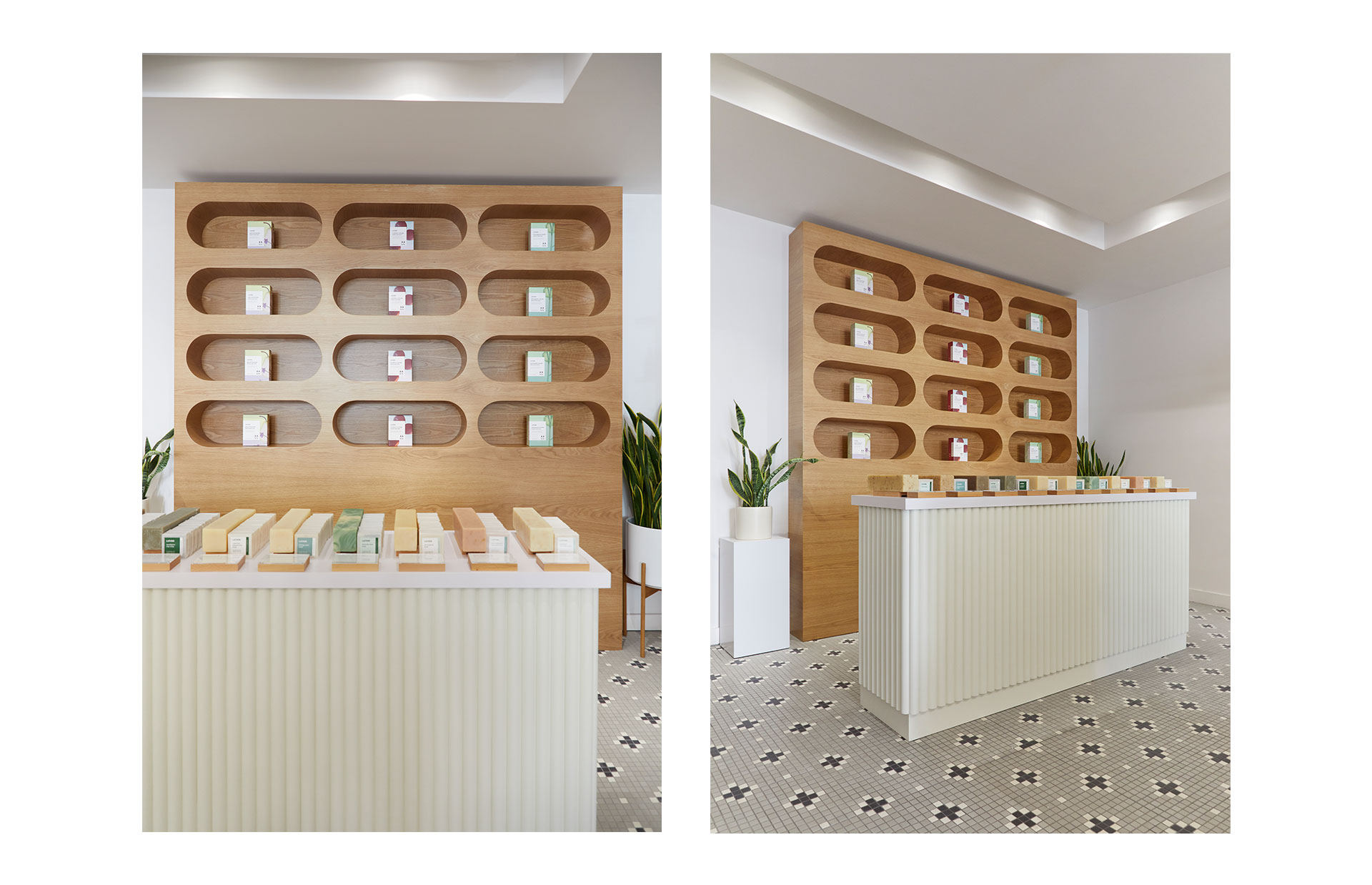 The oak alcove wall of boxed products above the ridged checkout counter, shown from two angles, with cross-patterned tile flooring and a potted plant.