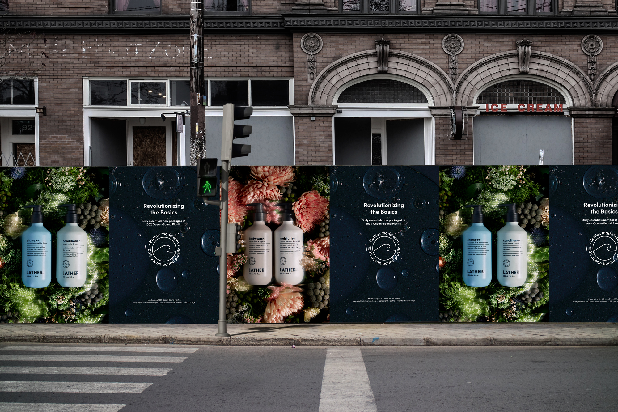 Landscapes Collection out-of-home posters wheat-pasted along a city street hoarding, alternating 'Revolutionizing the Basics' product ads with the ocean-bound-plastic wave seal, beneath an ornate brick building facade.
